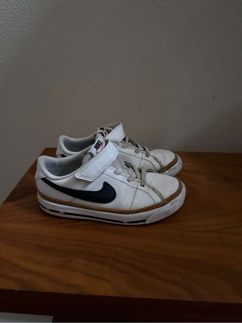 Nike Kids White Sneakers with Black Swoosh and Tan Trim
